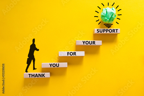 Thank you for support symbol. Concept words Thank you for your support on wooden blocks on a beautiful yellow table yellow background. Businessman icon. Business and thank you for support concept.