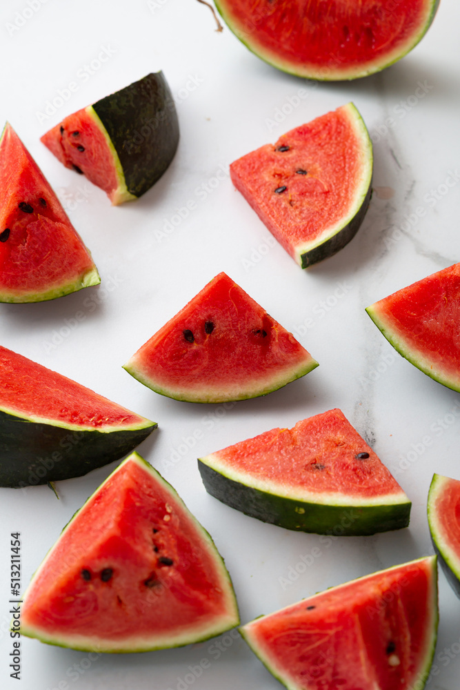 Green watermelon sliced pieces summer concept top view Green watermelon sliced pieces summer concept top view