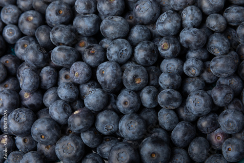 Blueberry. Ripe and fresh blueberries on a black textured background. Vitamins. Healthy food. Juicy berry. Copy space. Place for text