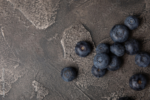 Blueberry. Ripe and fresh blueberries on a black textured background. Vitamins. Healthy food. Juicy berry. Copy space. Place for text
