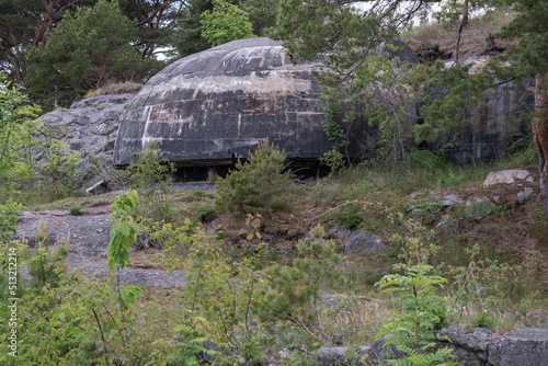 Kalvoysund, Norway - May 27, 2022: Kalvoysund fortress was a German coastal battery composed of some 50 shelters and casemates as well as four 105mm guns. Selective focus. photo