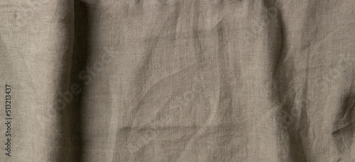 Abstract linen fabric texture background. Crumpled natural linen organic eco textiles canvas background. Top view