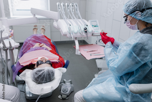 Preparation of equipment for procedures by a female dentist in the dental office