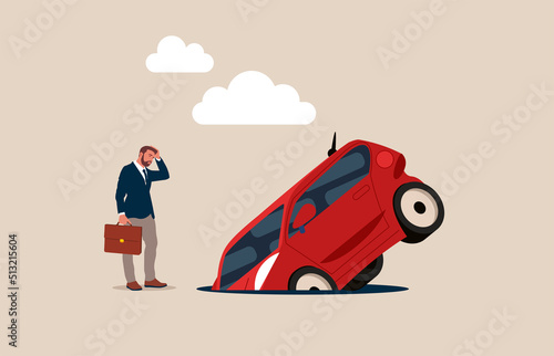 The car fell into a pit on the road. Pothole road, car damages. Danger on the highway. 