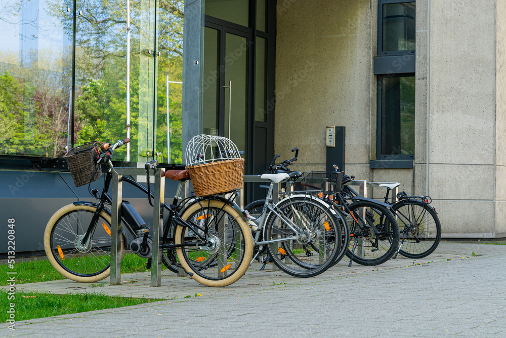 Bicycles standing near the administrative building. Wicker korb.