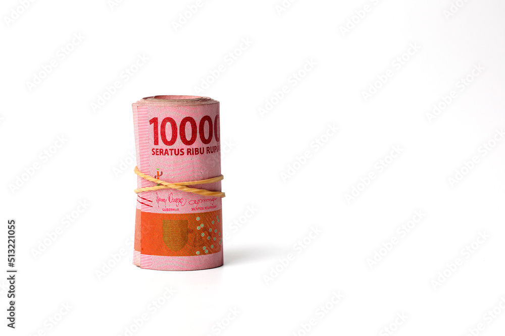 Roll of Indonesian money. Isolated on white background with copyspace Roll of Indonesian money. Isolated on white background with copyspace