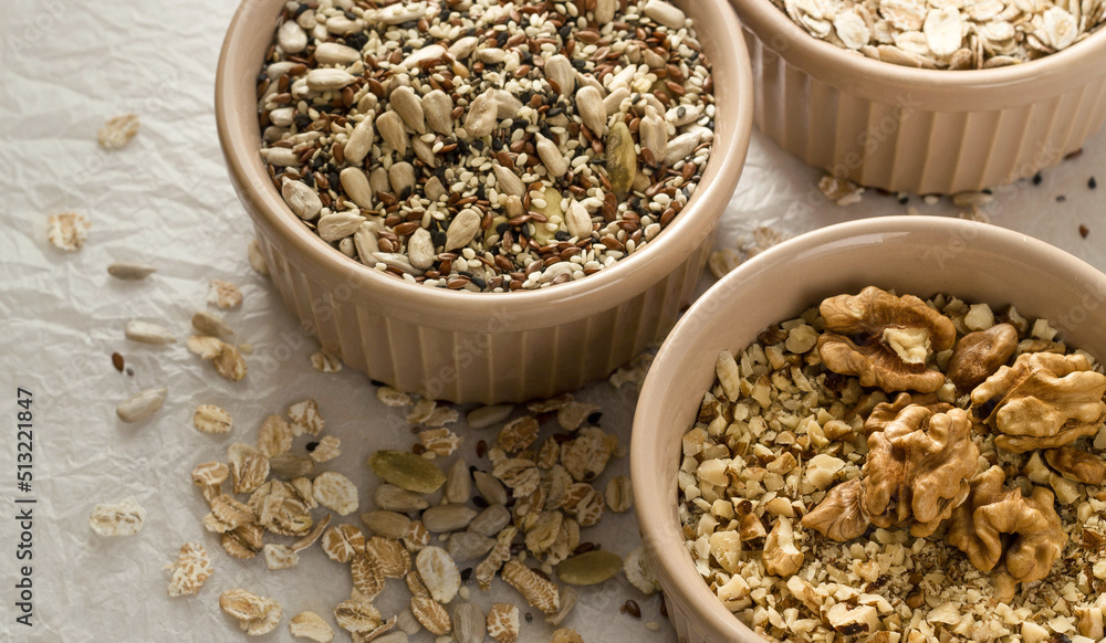 seeds, nuts and cereals in a bowls seeds, nuts and cereals in a bowls