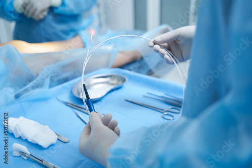 Doctor preparing for vein surgery in modern clinic