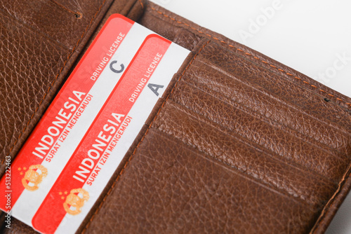 Yogyakarta, Indonesia - June 14, 2022 : Indonesian driving license in a pocket or wallet photo