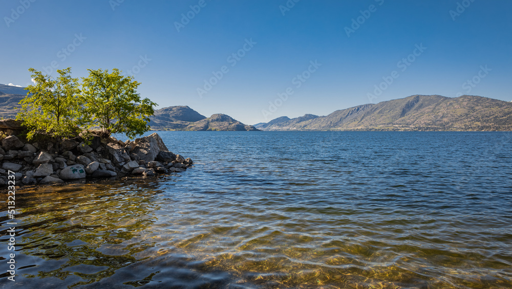 Okanagan Lake, Canada. Summer landscape of a lake and mountains in the background in early morning