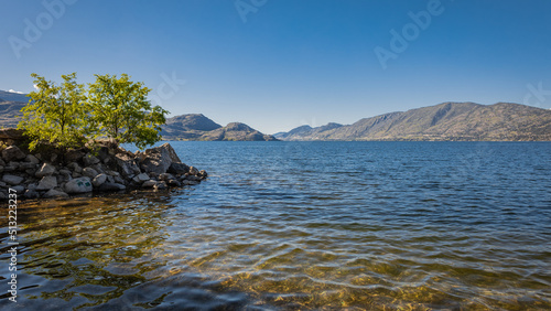 Okanagan Lake  Canada. Summer landscape of a lake and mountains in the background in early morning