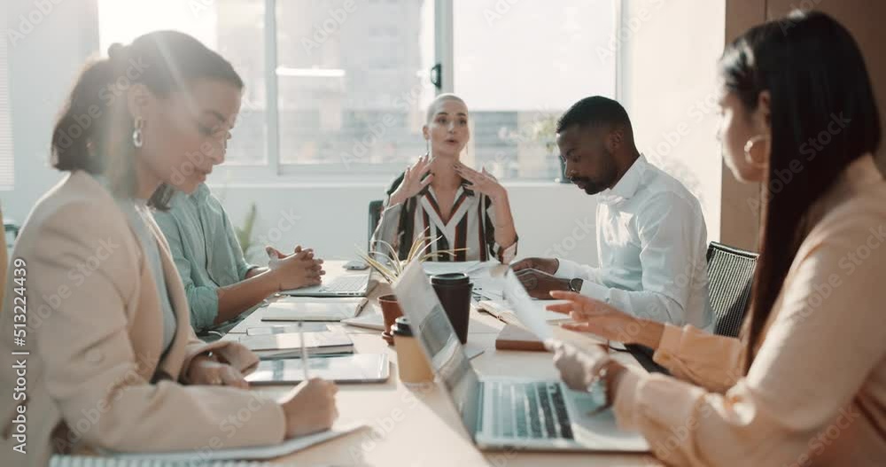 Ambitious colleagues analysing reports and documents while planning and brainstorming strategies in startup agency. Diverse group of businesspeople passing paperwork during meeting in office boardroom