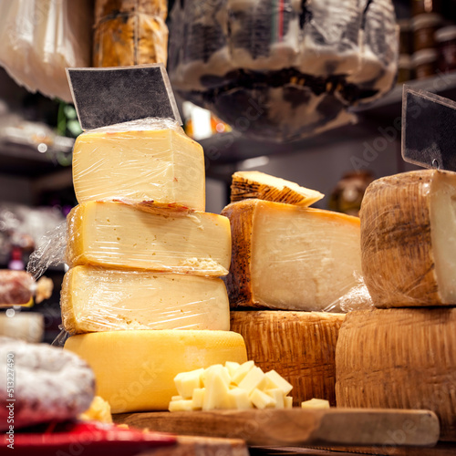 Italian food market with cheese, formaggio crociato fresco, Tuscan delicatessen stall display, Florence, Italy