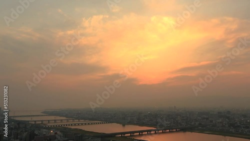 8 April 2014 Skyline of Osaka Japan, sunset of Yodogawa River photo