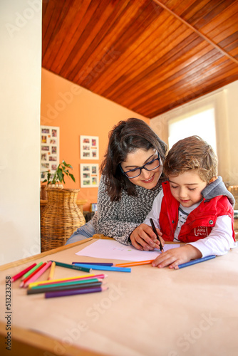 Mom Helping Young Son to Draw. Happy Family Moment while Learning New Things.