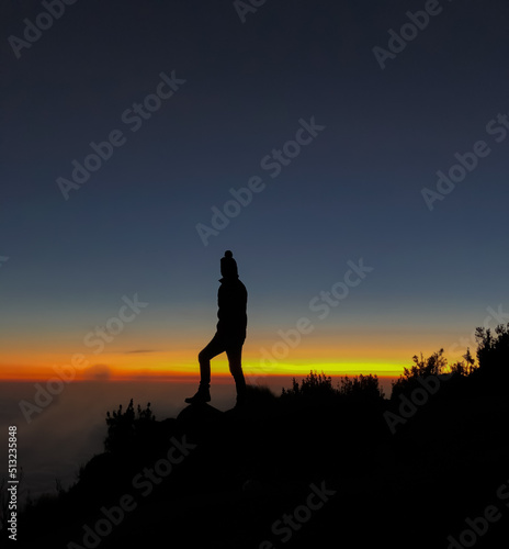 silhouette of person running on sunset