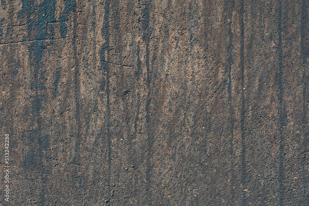 Naklejka premium The texture of an old dirty dark-colored wall