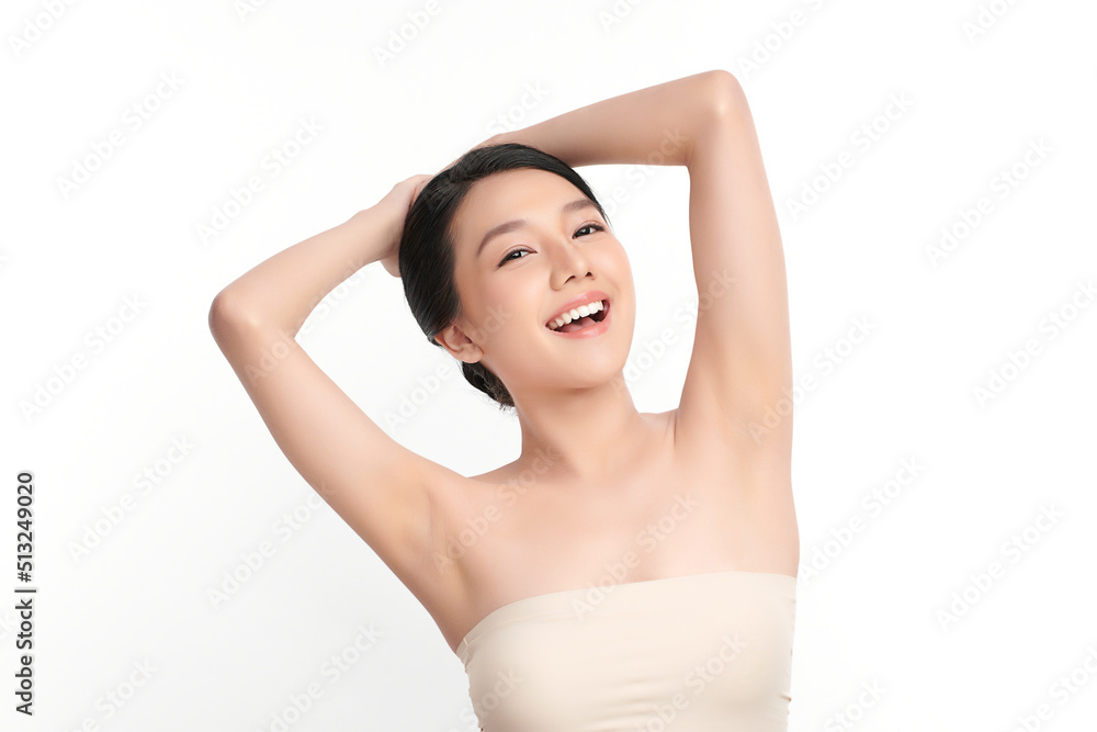Beautiful Young Asian woman lifting hands up to show off clean and hygienic armpits or underarms on white background, Smooth armpit cleanliness and protection concept Beautiful Young Asian woman lifting hands up to show off clean and hygienic armpits or underarms on white background, Smooth armpit cleanliness and protection concept