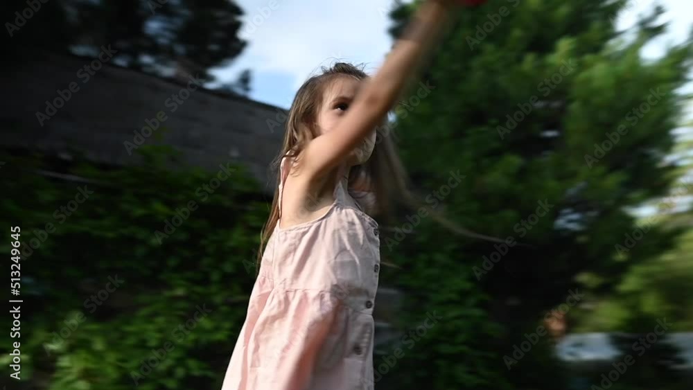 Little girl plays with an airplane outdoors. Video 360 degrees. Little girl plays with an airplane outdoors. Video 360 degrees.