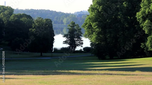 Stockholm, Sweden A calm morning view of a field and the Brunnsviken lake.  photo