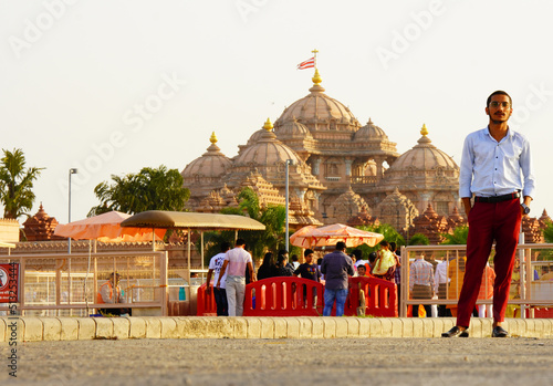 indian young man with akshardham temple delhi photo