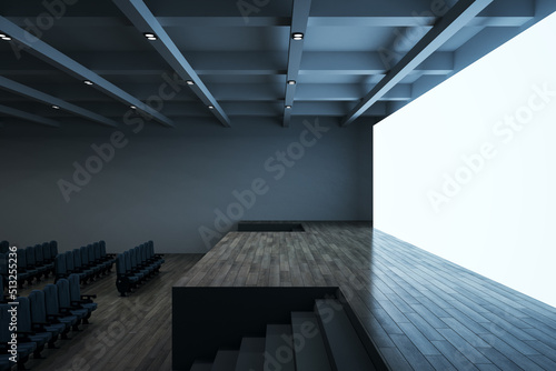 Side view on empty hall with blank white illuminated screen with space for your text or logo, wooden stage and seat rows. 3D rendering, mock up