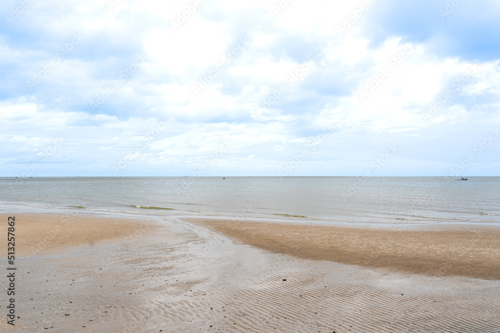 View of Pranburi beach and fishing boats in the calm sea. View of Pranburi beach and fishing boats in the calm sea.