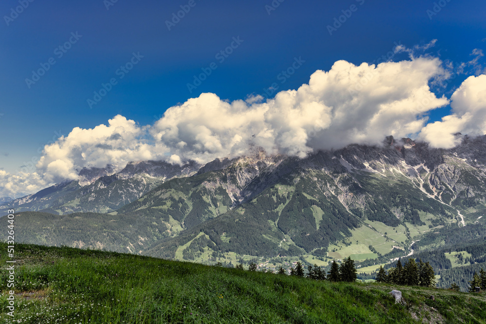 Beautiful summer landscape with dramatic clouds in the sky over impressive mountains - Hochkönig Austria