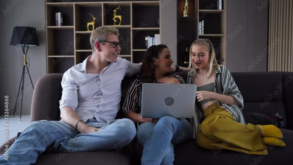 Happy family. Mom and dad shopping online. Children listen to music and play games on weekends in the house. Happy family. Mom and dad shopping online. Children listen to music and play games on weekends in the house.