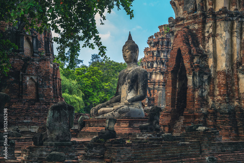 Prang and Buddha statue, Wat Mahathat, Ayutthaya, thailand © Richie Chan