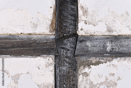 Obraz na plátně Grunge background with white wall and dark wooden beams
