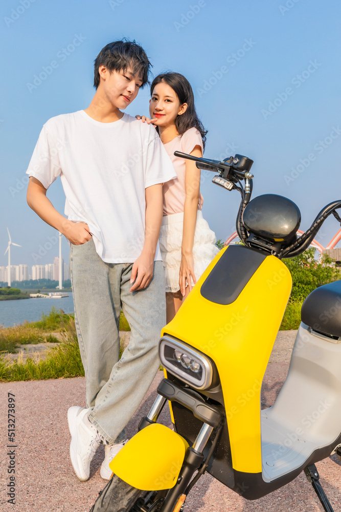 Couples travel in electric bicycle