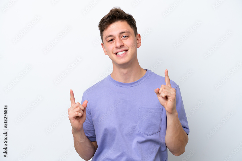 Young handsome Brazilian man isolated on white background pointing up a great idea Young handsome Brazilian man isolated on white background pointing up a great idea