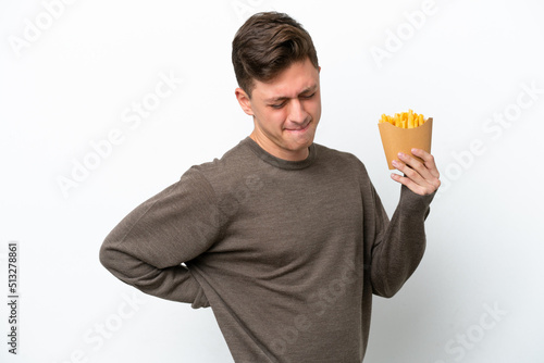 Young Brazilian man holding fried chips isolated on white background suffering from backache for having made an effort