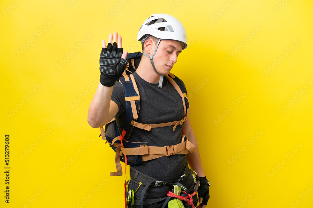 Young rock climber Brazilian man making stop gesture and disappointed Young rock climber Brazilian man making stop gesture and disappointed
