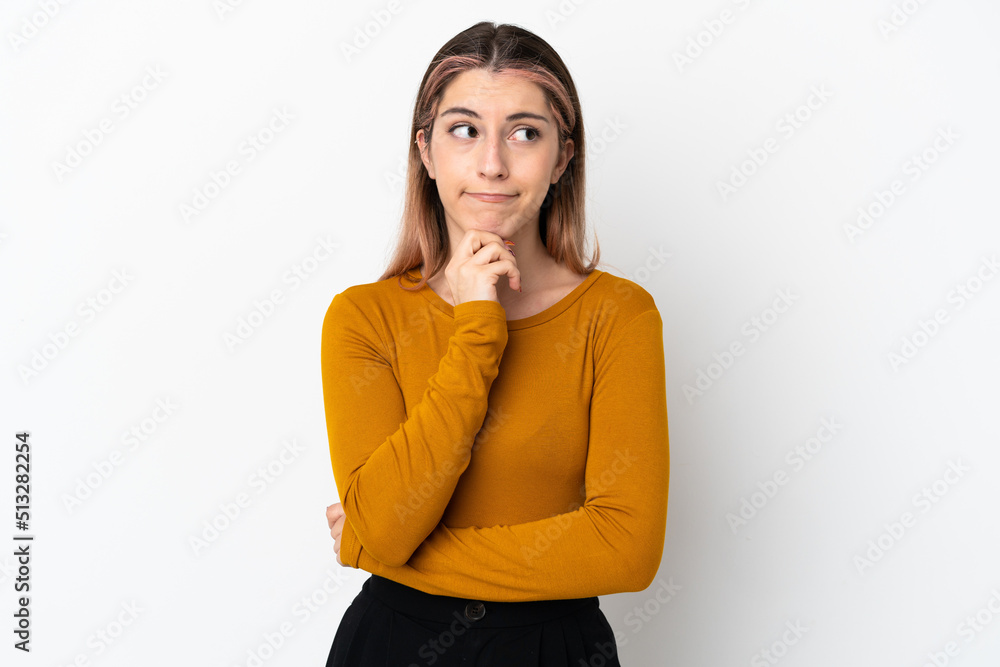Young caucasian woman isolated on white background having doubts and thinking Young caucasian woman isolated on white background having doubts and thinking