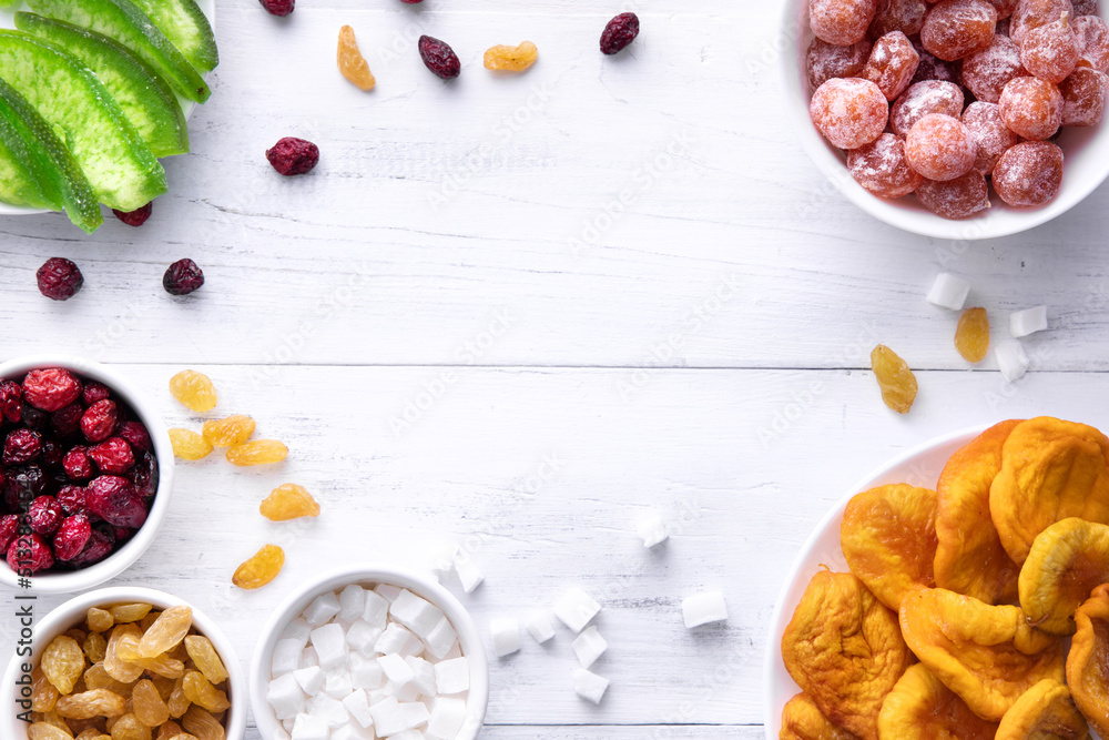 flat lay different dried fruits on the white wooden table place for the tex flat lay different dried fruits on the white wooden table place for the tex