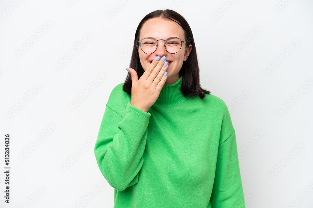 Young caucasian woman isolated on white background happy and smiling covering mouth with hand