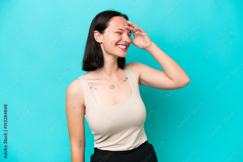 Young caucasian woman isolated on blue background smiling a lot Young caucasian woman isolated on blue background smiling a lot