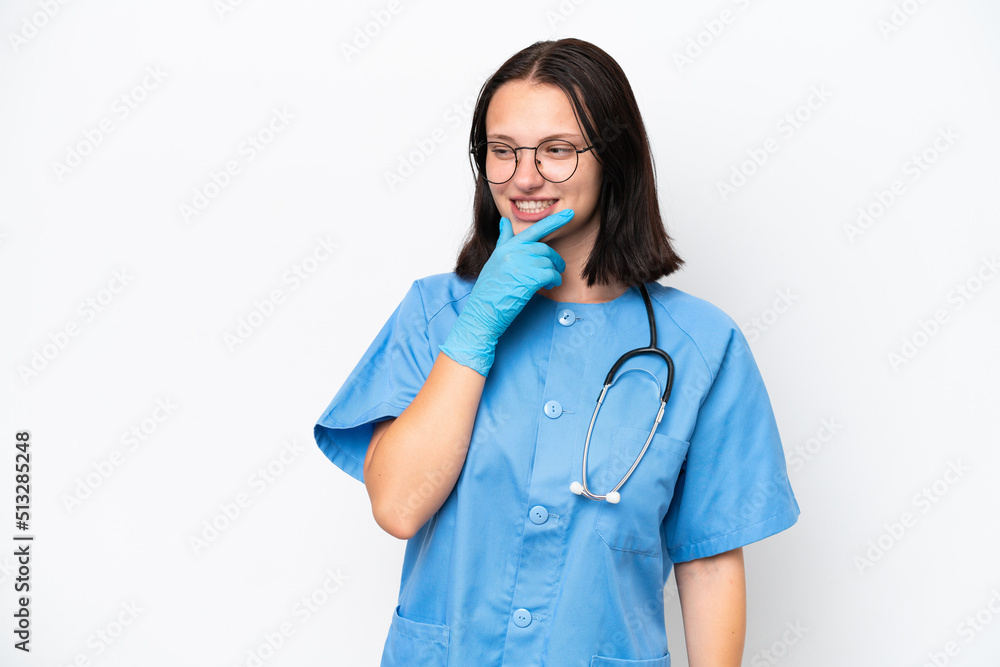 Young nurse caucasian woman isolated on white background looking to the side Young nurse caucasian woman isolated on white background looking to the side