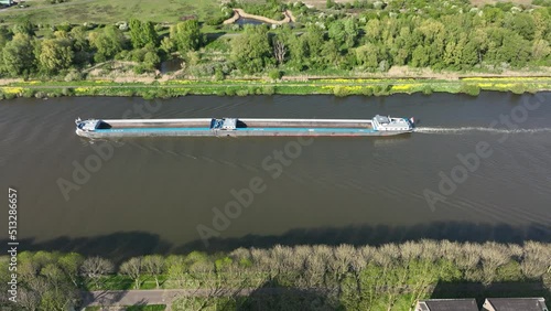 Inland shipping logistics transportation of goods over water way infrastructure in the Netherlands Amsterdam Rijnkanaal. Empty double barge sailing shipment of freight aerial drone view. photo