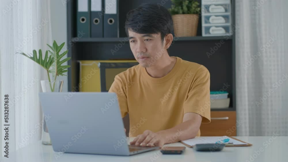 Asian man working at home, working from home freelancer concept. teleconference online. Asian man working at home, working from home freelancer concept. teleconference online.