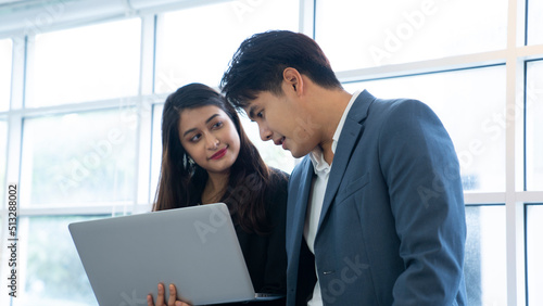 asian couple working at office