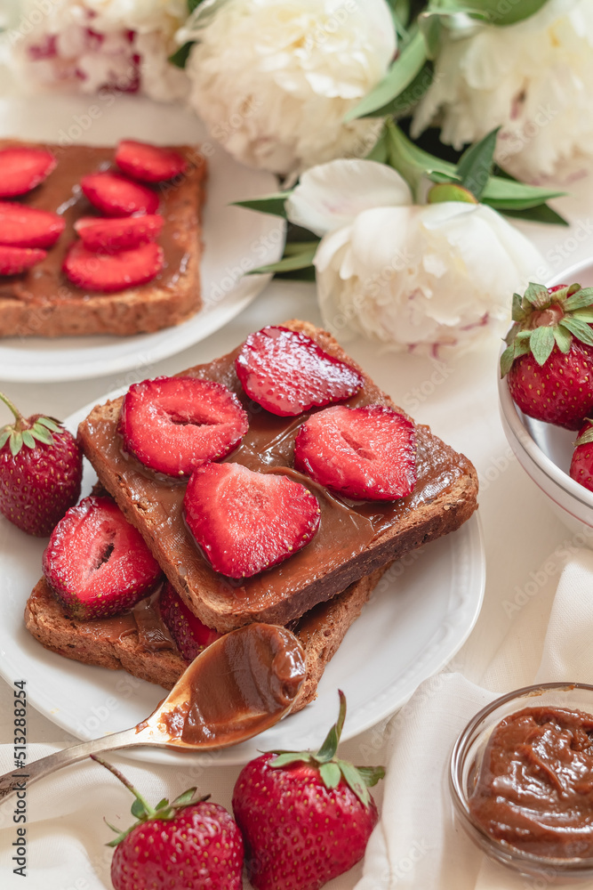 French toast with fresh red strawberries and chocolate cream.