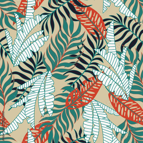 Fashionable seamless tropical pattern with bright plants and leaves on a soft green background. Beautiful exotic plants.  Modern abstract design for fabric  paper  interior decor.