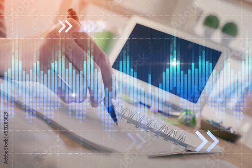 Financial forex graph drawn over hands taking notes background. Concept of research. Double exposure © peshkova