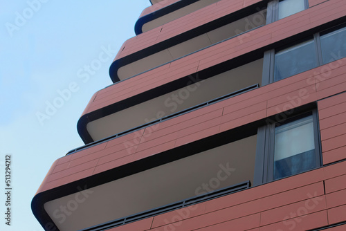 Photography Close up of the corner of a building, showing balconies, windows