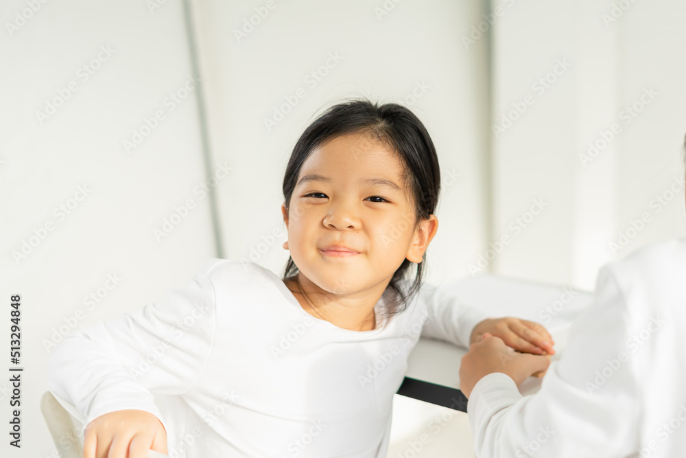 cute little children smile, happy, wear white shirt, look at camera with copy space. asian children study and learn alphabet, scrabble, crossword in education classroom at small school cute little children smile, happy, wear white shirt, look at camera with copy space. asian children study and learn alphabet, scrabble, crossword in education classroom at small school