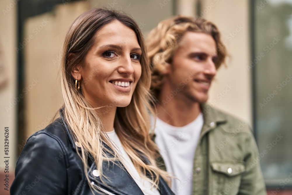 Man and woman couple smiling confident hugging each other at street Man and woman couple smiling confident hugging each other at street