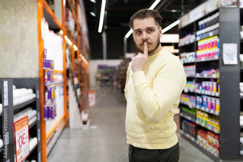 The buyer cannot decide on the color and texture of the walls when choosing paint in a hardware store